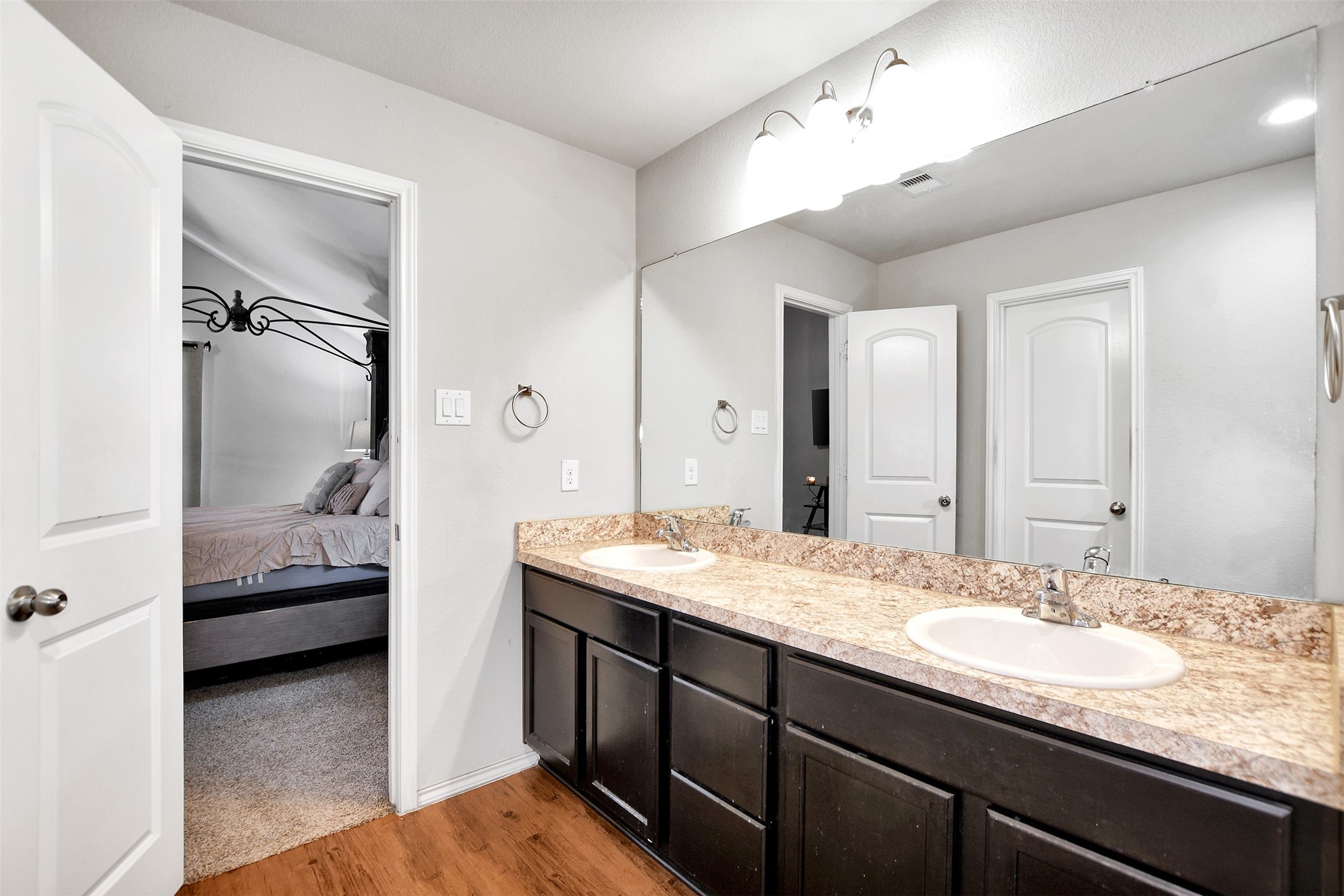 1022 Rancho Grande Drive Channelview, TX 77530 - Photo 26 of 36 a en suite bathroom with a granite countertop sink and a mirror