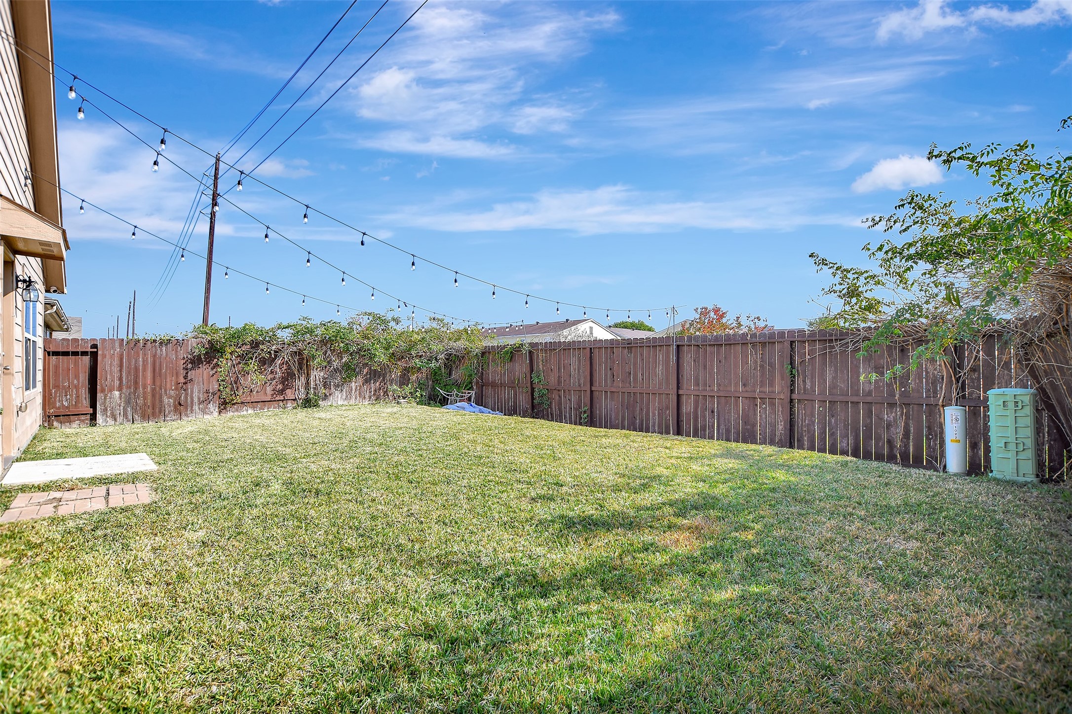 1022 Rancho Grande Drive Channelview, TX 77530 - Photo 32 of 36 a view of a backyard with tree