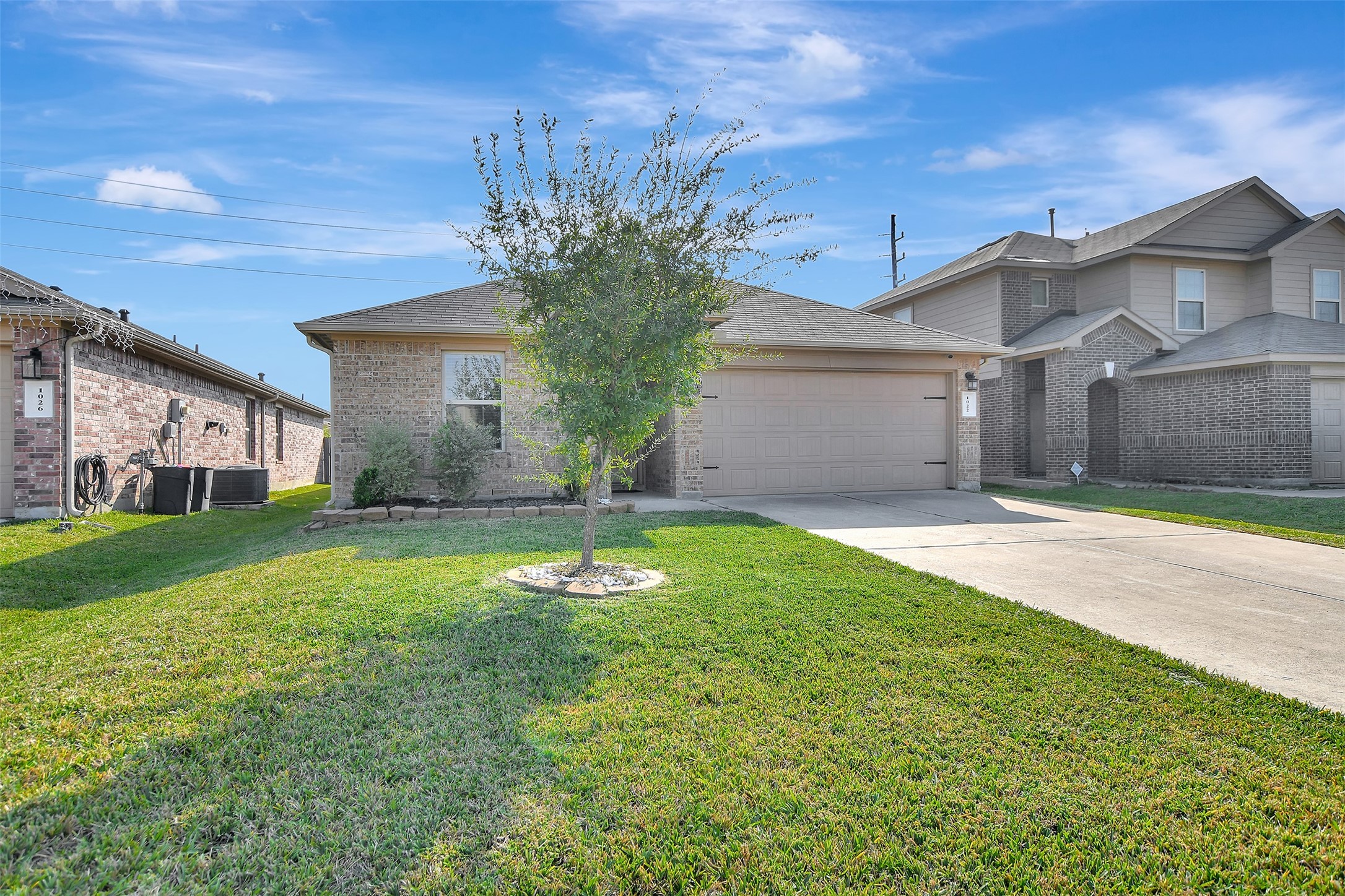 1022 Rancho Grande Drive Channelview, TX 77530 - Photo 4 of 36 a front view of a house with garden