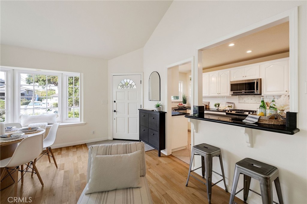 4914 Halison Street Torrance, CA 90503 - Photo 15 of 51 a kitchen with a table chairs microwave and cabinets