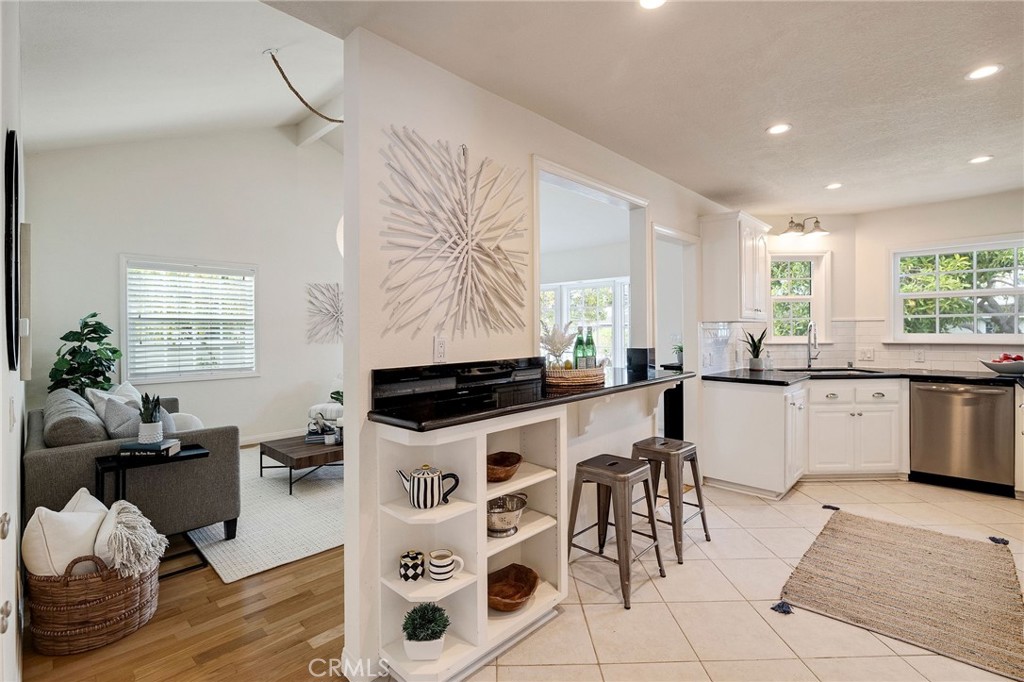 4914 Halison Street Torrance, CA 90503 - Photo 16 of 51 a kitchen with stainless steel appliances a center island sink and cabinets