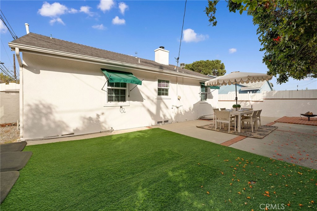 4914 Halison Street Torrance, CA 90503 - Photo 32 of 51 a view of a chair and table in backyard of the house