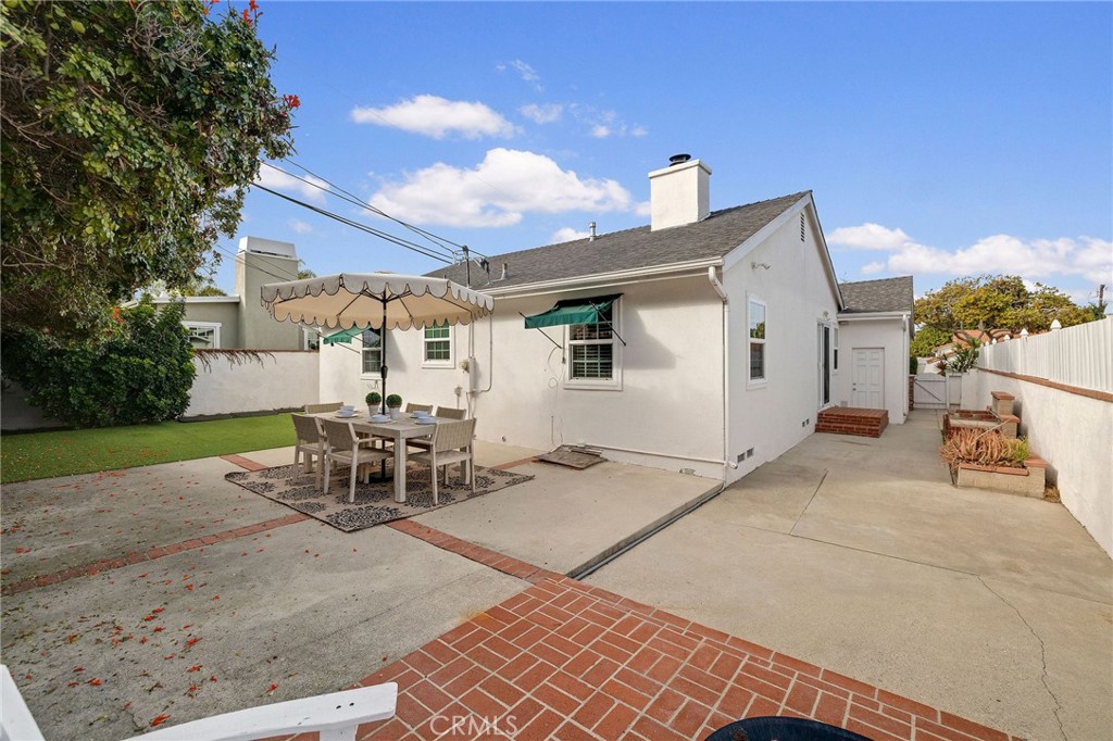 4914 Halison Street Torrance, CA 90503 - Photo 34 of 51 a view of a patio with table and chairs with a barbeque grill and plants