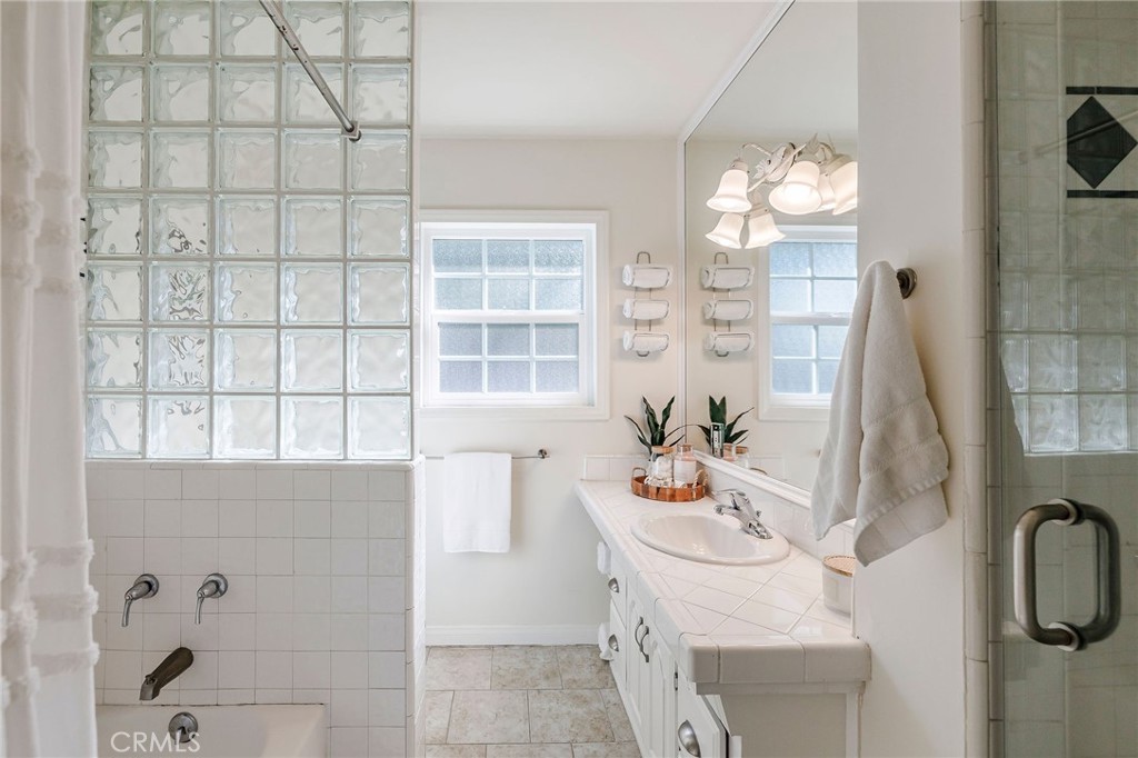 4914 Halison Street Torrance, CA 90503 - Photo 37 of 51 a bathroom with a bathtub sink and mirror