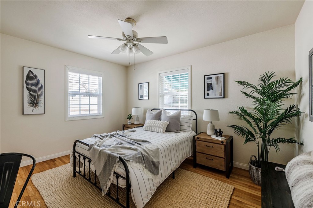 4914 Halison Street Torrance, CA 90503 - Photo 38 of 51 a bedroom with a large bed and a chandelier