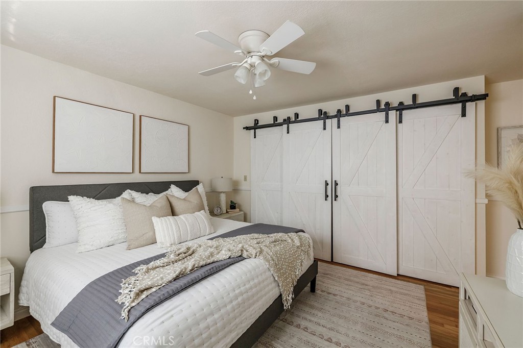 4914 Halison Street Torrance, CA 90503 - Photo 48 of 51 a bedroom with a bed and a ceiling fan