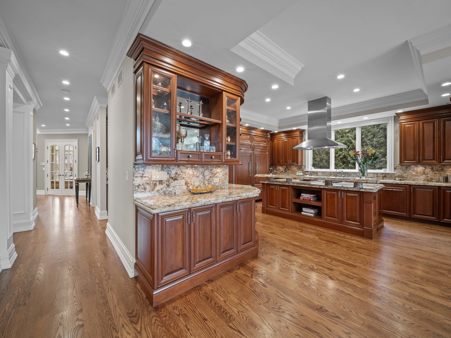 700 Greenwood Road Northbrook, IL 60062 - Photo 17 of 81 a large kitchen with stainless steel appliances kitchen island granite countertop a large counter top and a stove