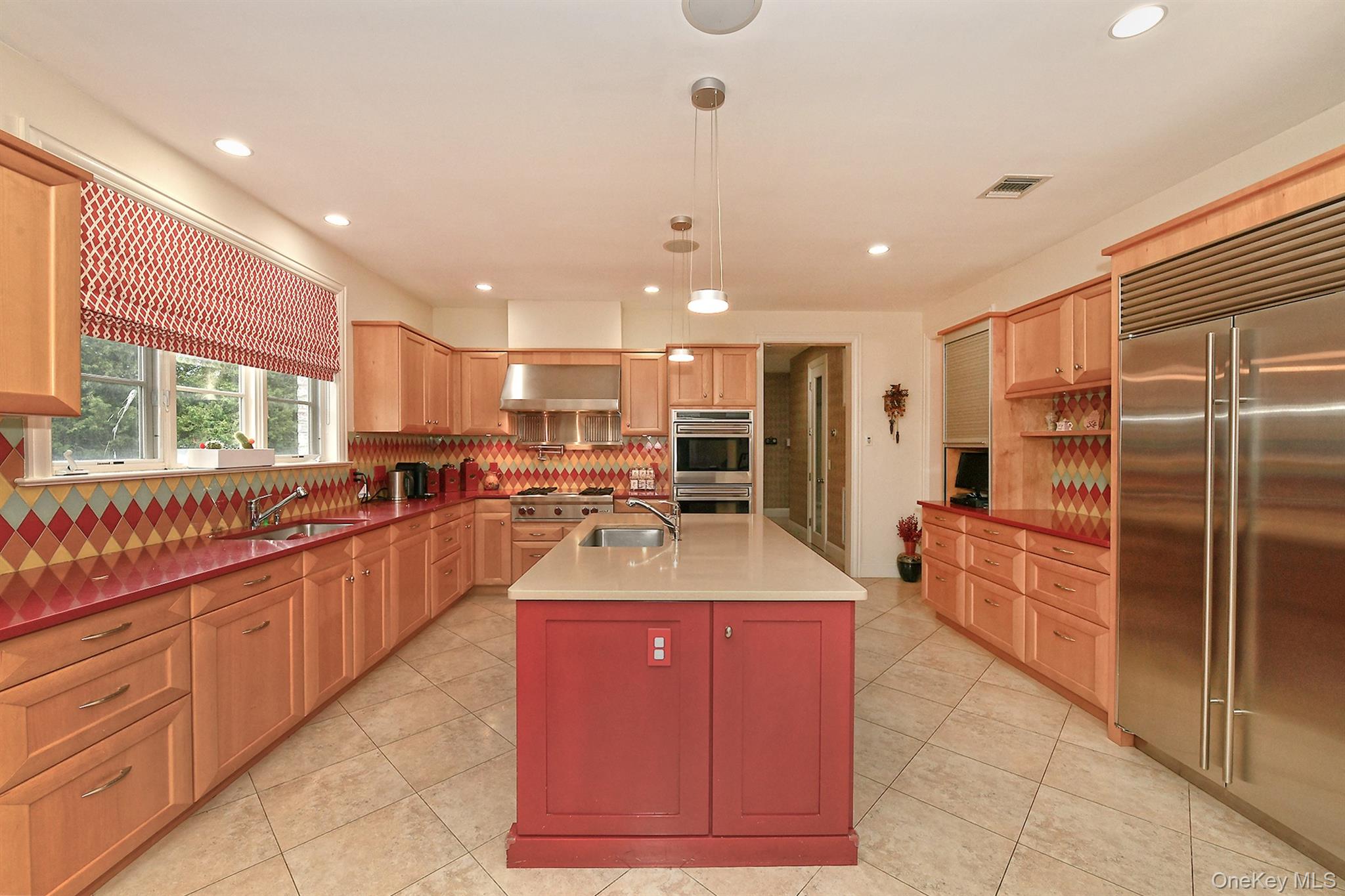 14 Norgate Road Glen Head, NY 11545 - Photo 15 of 44 a large kitchen with kitchen island a large counter top stainless steel appliances and cabinets