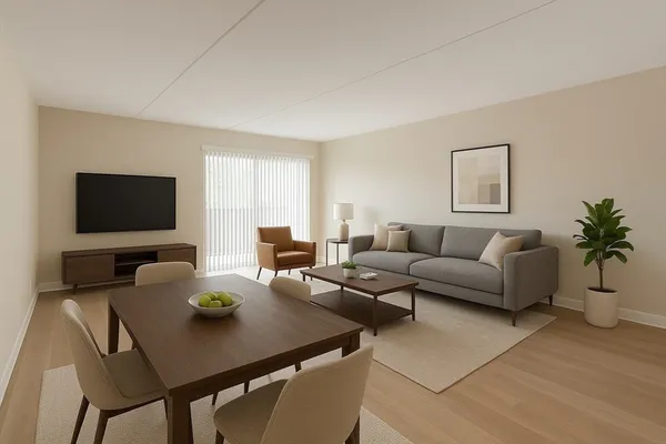 a living room with furniture a flat screen tv and a window