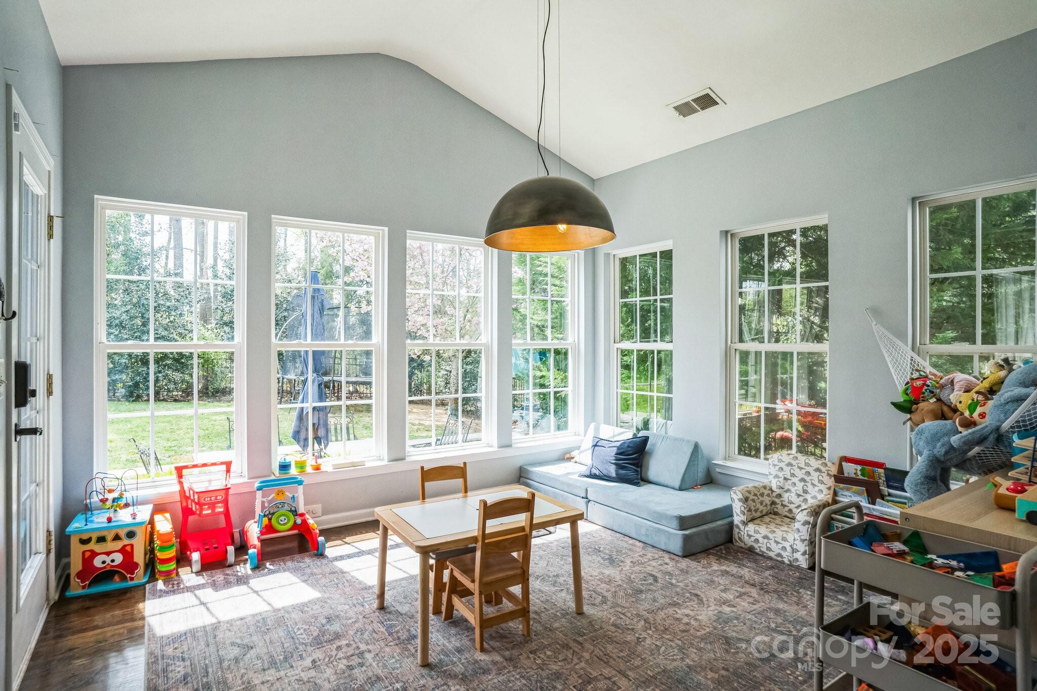 7215 Meyer Road Fort Mill, SC 29715 - Photo 18 of 35 a living room filled with furniture and a potted plant