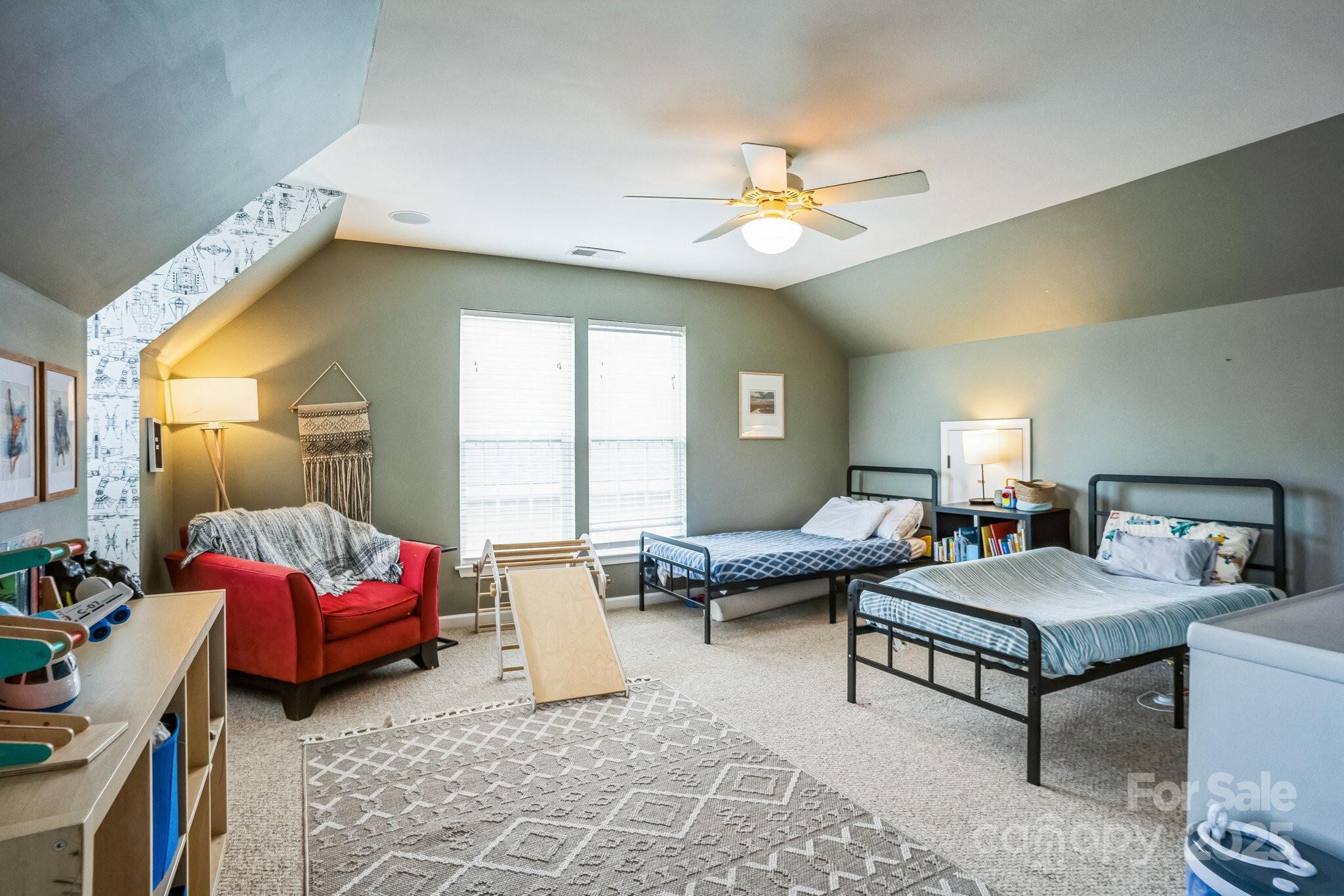 7215 Meyer Road Fort Mill, SC 29715 - Photo 25 of 35 a living room with furniture and a chandelier