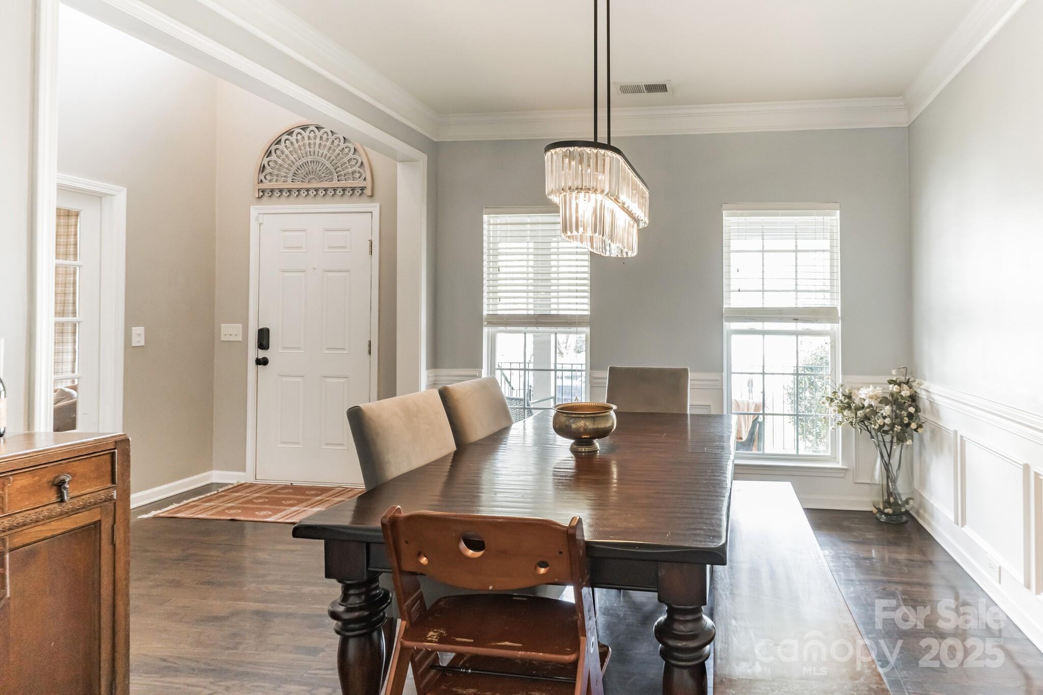 7215 Meyer Road Fort Mill, SC 29715 - Photo 9 of 35 a view of a dining room with furniture window and wooden floor