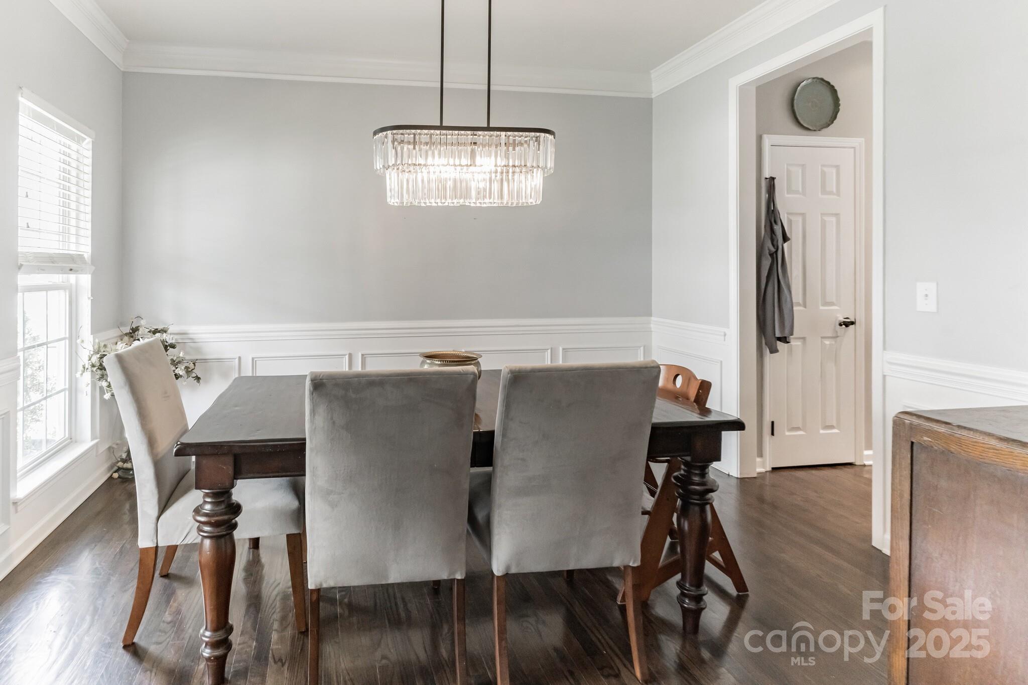 7215 Meyer Road Fort Mill, SC 29715 - Photo 10 of 35 a view of a dining room with furniture and wooden floor