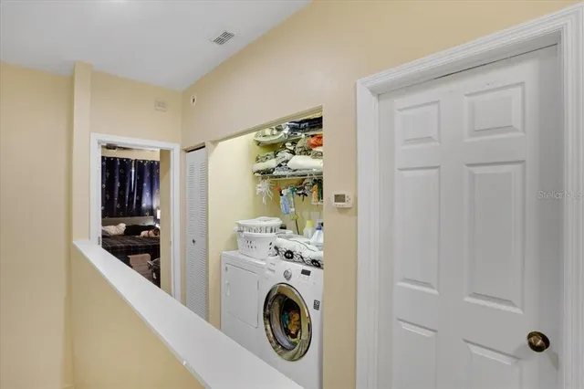 a utility room with dryer and washer
