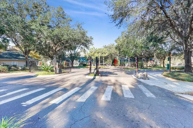 a view of a house with backyard sitting area and garden