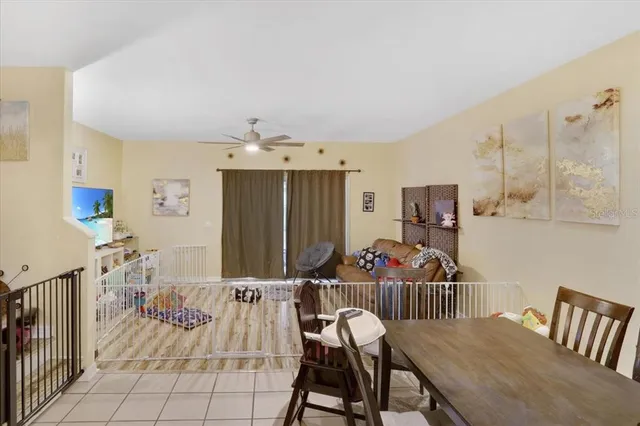a view of a dining room with furniture and chandelier