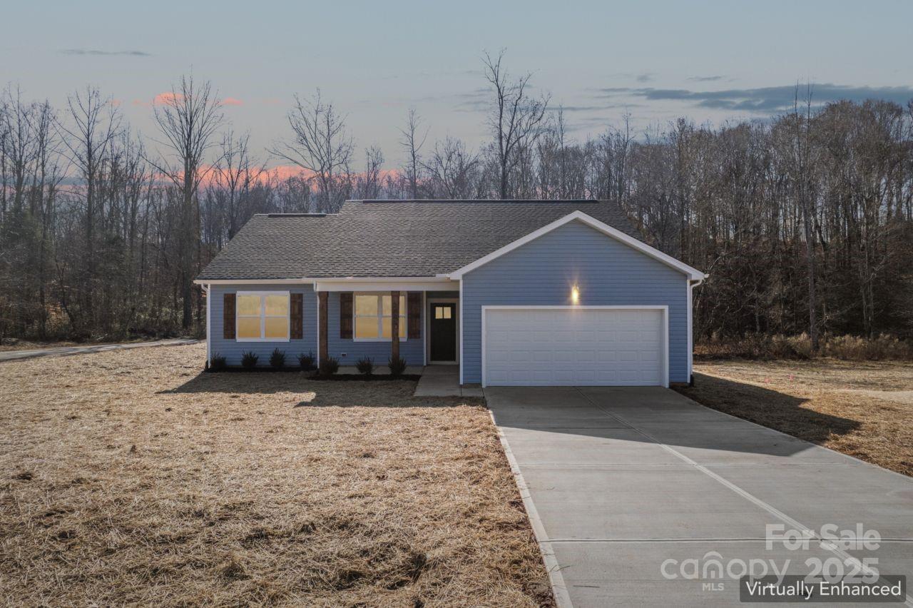 2605 Easter Street Maiden, NC 28650 - Photo 1 of 36 a front view of a house with a yard and garage