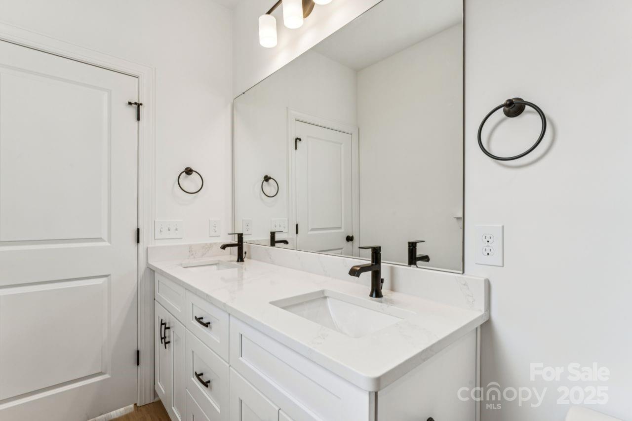 2605 Easter Street Maiden, NC 28650 - Photo 16 of 36 a bathroom with a sink and a mirror