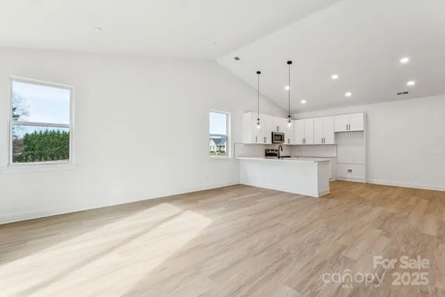 a view of kitchen with wooden floor