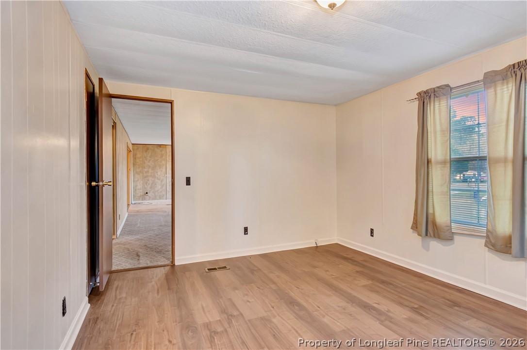 727 Rice Road Lumberton, NC 28358 - Photo 14 of 30 wooden floor in an empty room