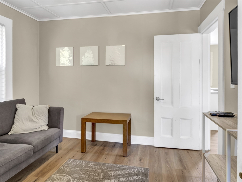 52 H Street Hull, MA 02045 - Photo 12 of 41 a view of livingroom with furniture and wooden floor