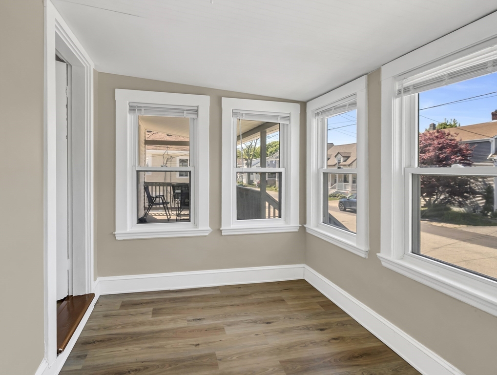52 H Street Hull, MA 02045 - Photo 14 of 41 a view of an empty room with wooden floor and a window