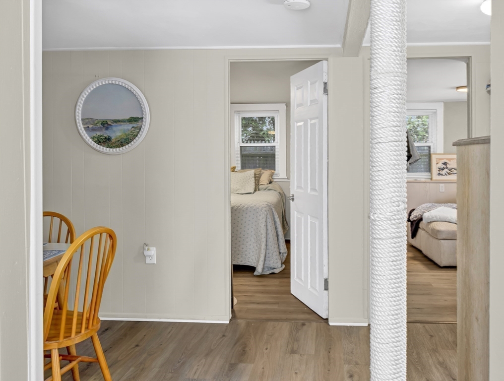 52 H Street Hull, MA 02045 - Photo 18 of 41 a view of a hallway with entryway and wooden floor