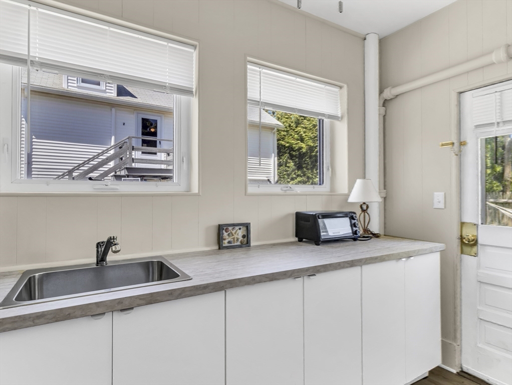 52 H Street Hull, MA 02045 - Photo 33 of 41 a kitchen with a sink and a window