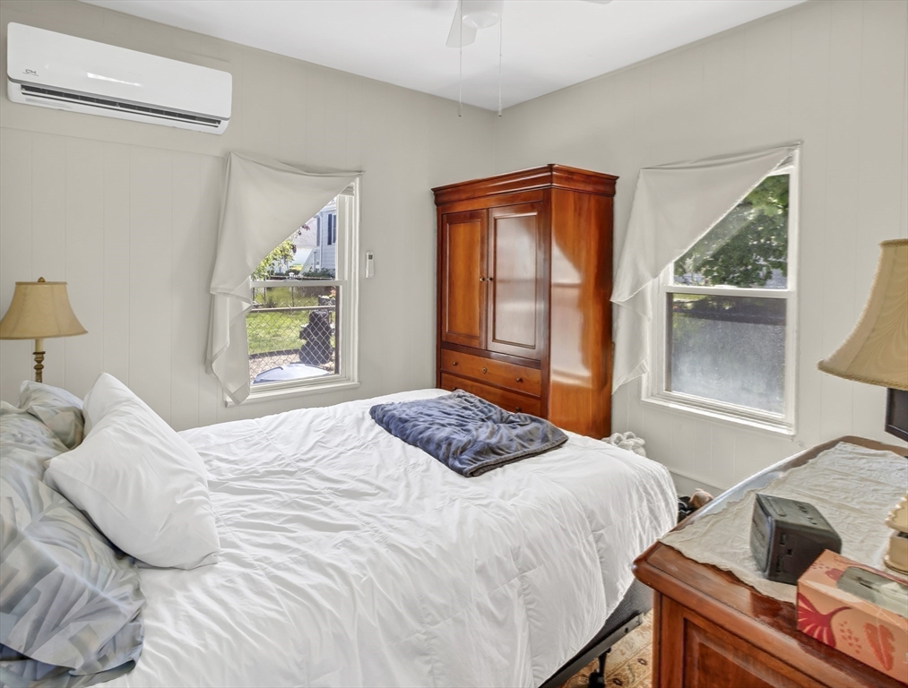 52 H Street Hull, MA 02045 - Photo 37 of 41 a bedroom with a bed and a window