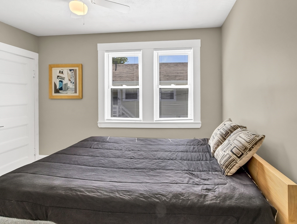 52 H Street Hull, MA 02045 - Photo 8 of 41 a bedroom with a bed and a window