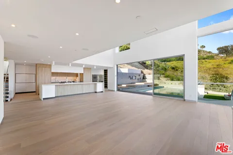 a view of balcony with wooden floor