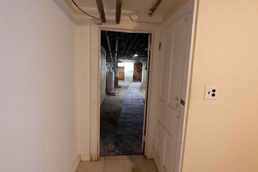 3637 Spring Garden Street Philadelphia, PA 19104 - Photo 15 of 39 a view of a hallway with wooden shelves