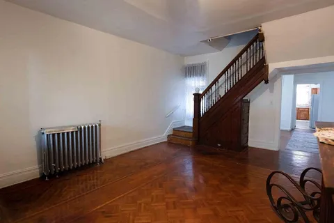 a view of an entryway with wooden floor