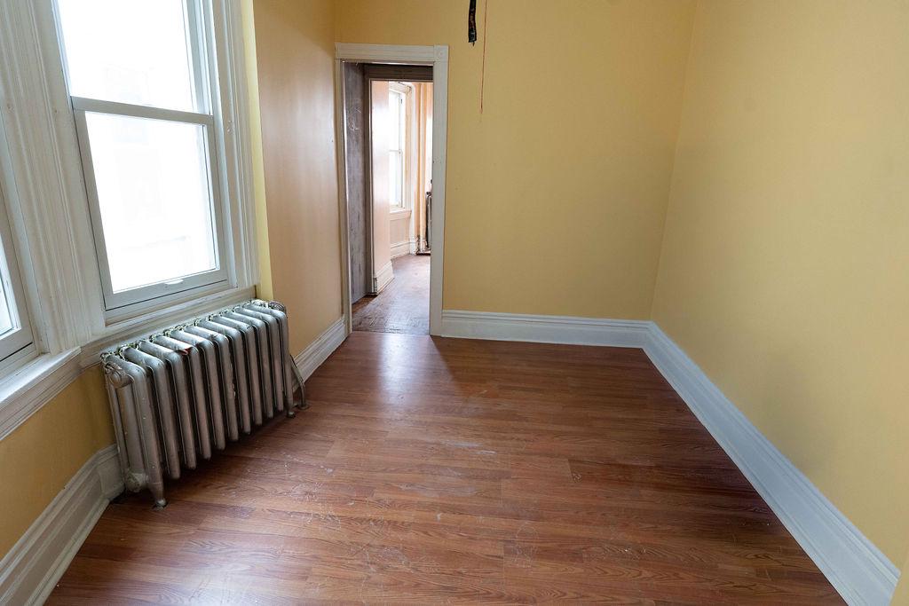 3637 Spring Garden Street Philadelphia, PA 19104 - Photo 28 of 39 a view of a hallway with wooden floor and a window
