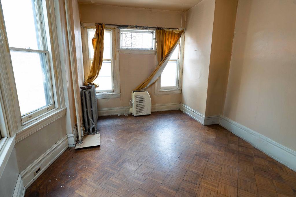 3637 Spring Garden Street Philadelphia, PA 19104 - Photo 29 of 39 a view of entryway and bedroom with a chair