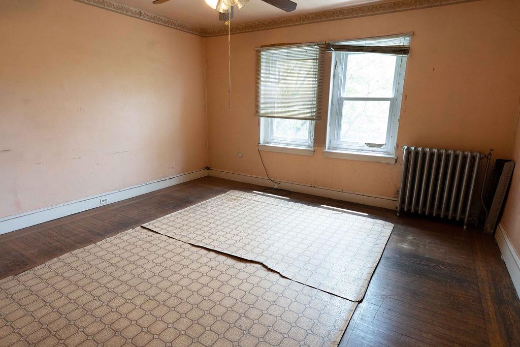 3637 Spring Garden Street Philadelphia, PA 19104 - Photo 31 of 39 an empty room with wooden floor windows and fan