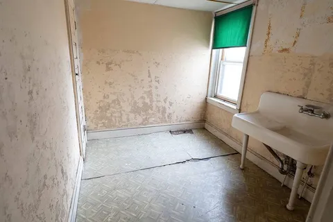 a bathroom with a toilet and a bathtub