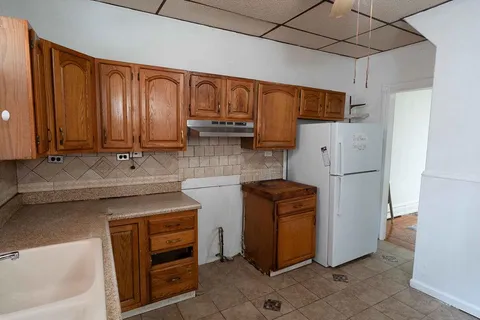 a kitchen with a sink and a window