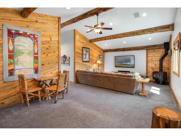 a living room with stainless steel appliances kitchen island granite countertop furniture and a kitchen view