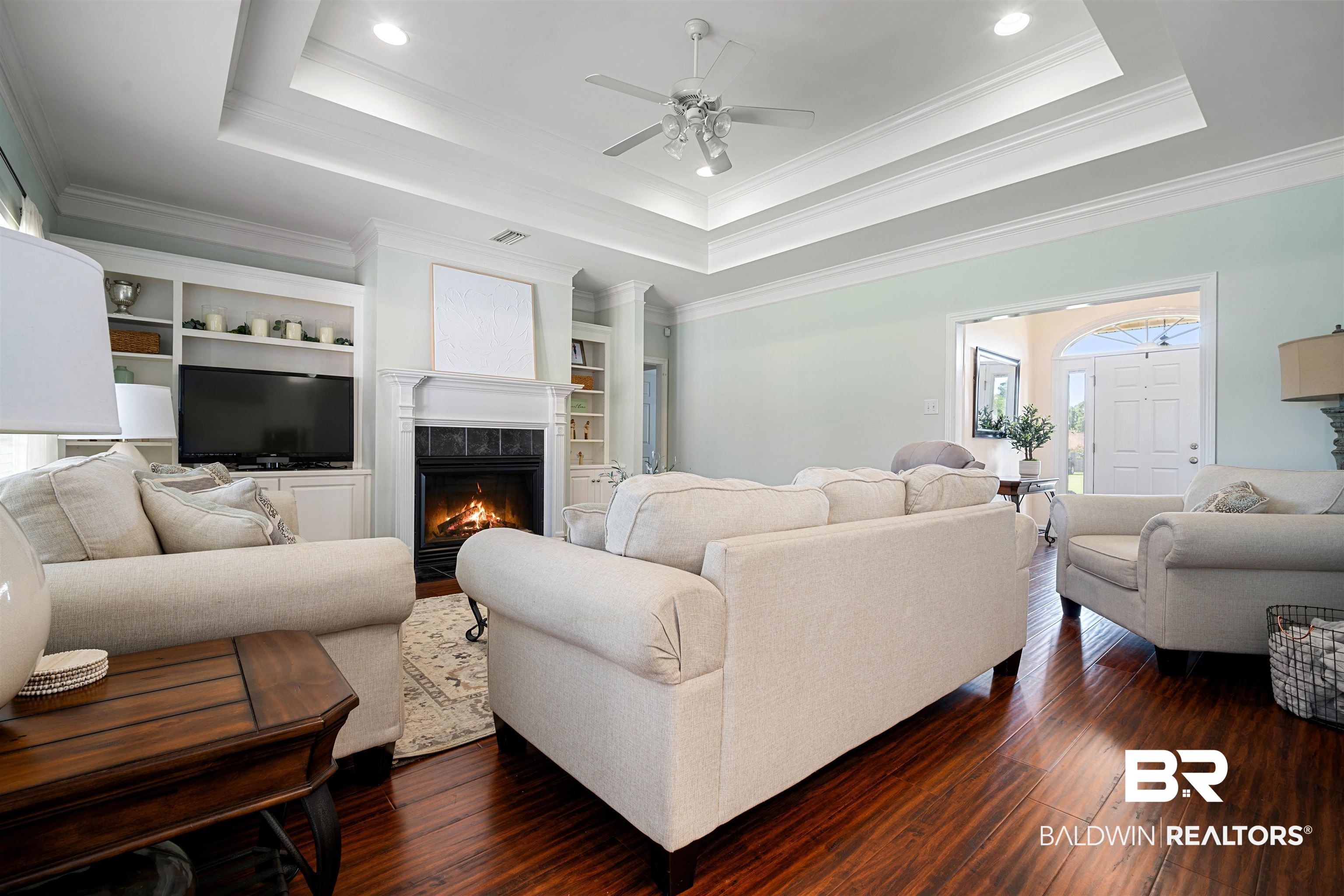9552 White Castle Road Mobile, AL 36695 - Photo 7 of 31 Living room with a tray ceiling, dark wood finished floors, a ceiling fan, and recessed lighting
