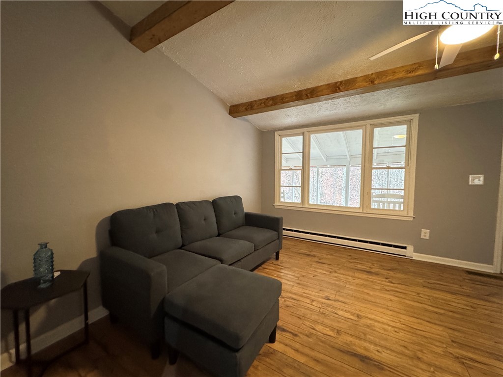 321 Skin Camp Creek Road Todd, NC 28684 - Photo 4 of 29 a living room with furniture and a window