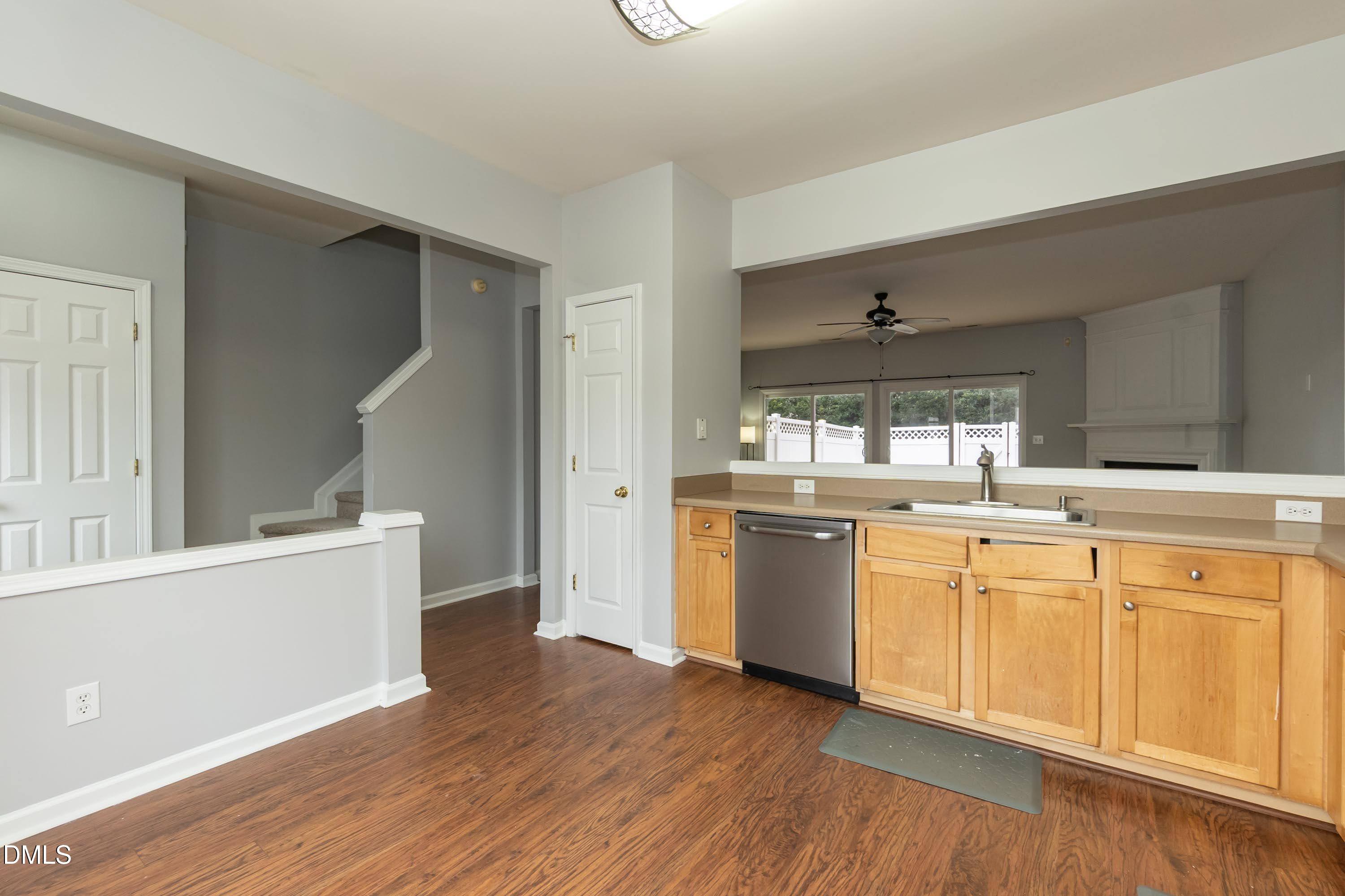 5141 TwelvePole Drive Raleigh, NC 27616 - Photo 19 of 40 a kitchen with granite countertop a white stove top oven and white cabinets