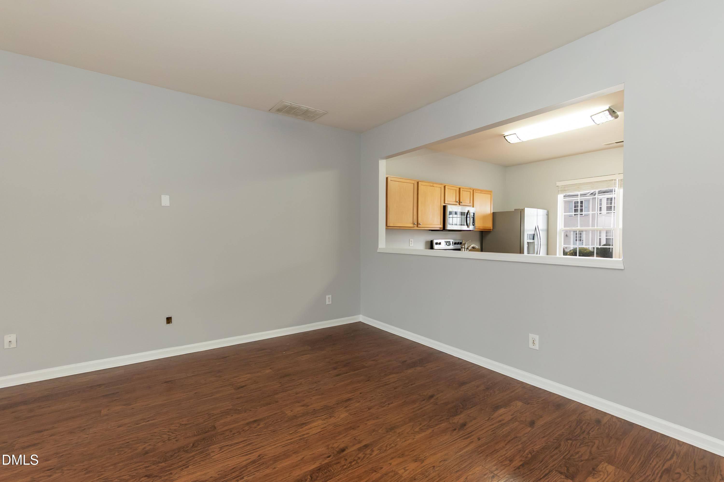 5141 TwelvePole Drive Raleigh, NC 27616 - Photo 20 of 40 a view of a room with wooden floor and window