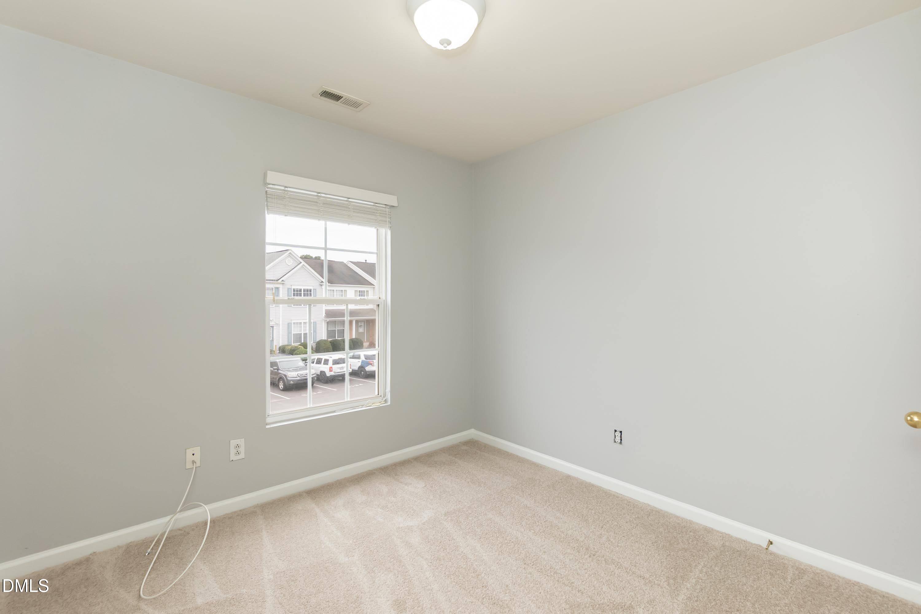 5141 TwelvePole Drive Raleigh, NC 27616 - Photo 24 of 40 a view of an empty room with a window
