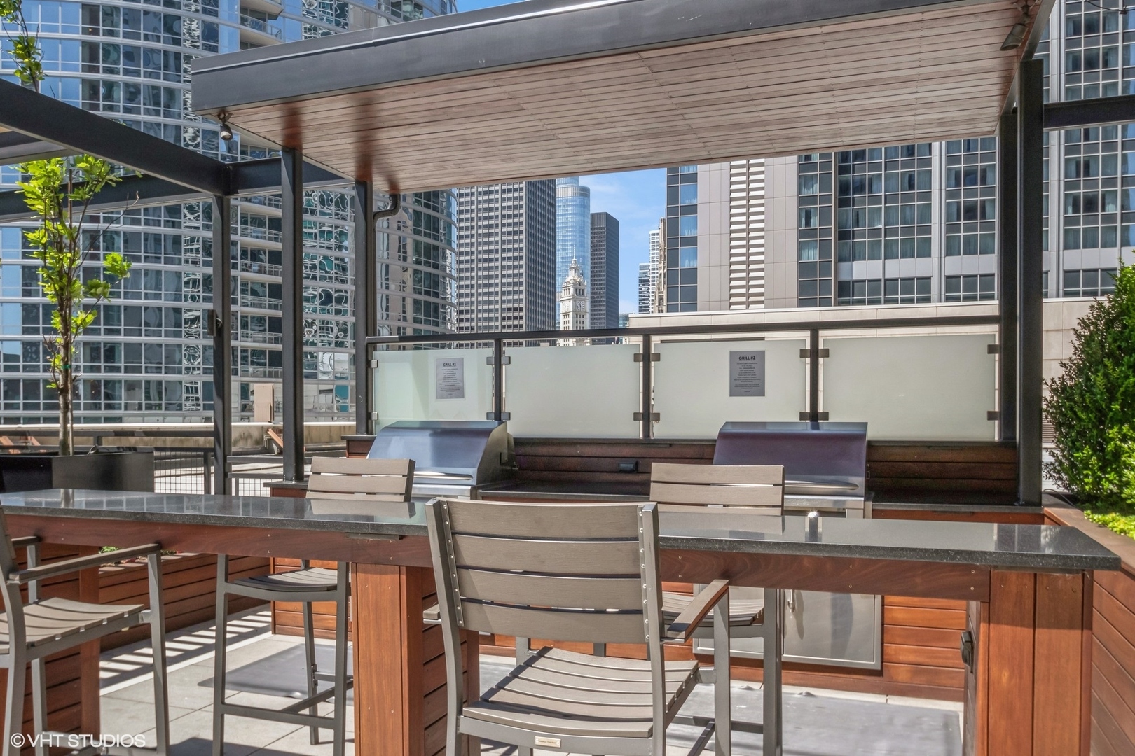 Undisclosed Address Chicago, IL 60611 - Photo 15 of 15 a table and chairs in front of a building