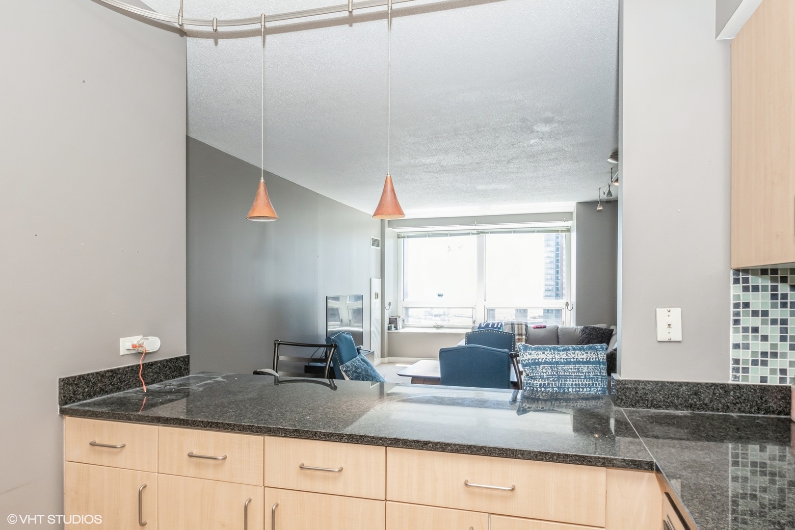 Undisclosed Address Chicago, IL 60611 - Photo 6 of 15 a kitchen with a granite countertop sink and a mirror