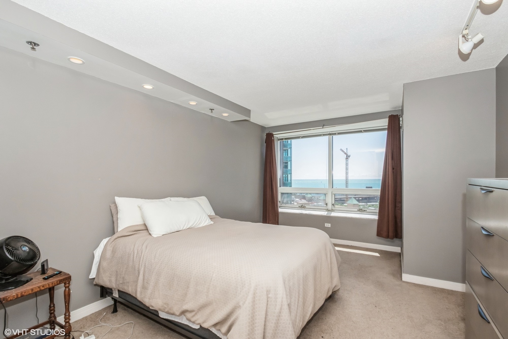 Undisclosed Address Chicago, IL 60611 - Photo 7 of 15 a bedroom with a bed and a window