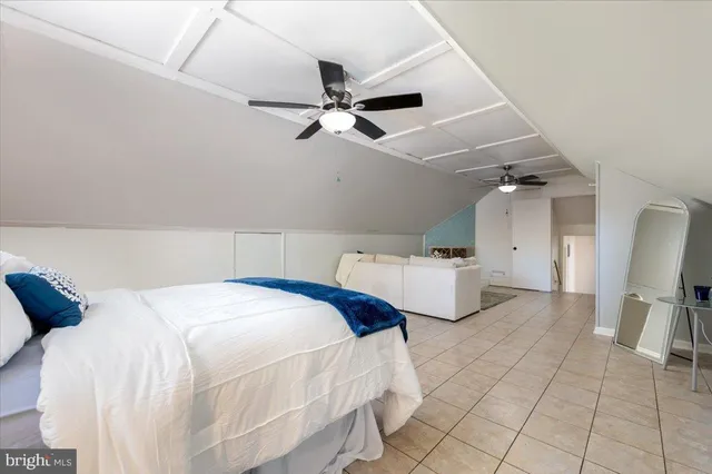 a view of backyard of house and car parked