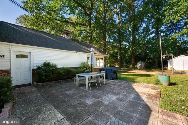 a picture of a bench in front of a wall