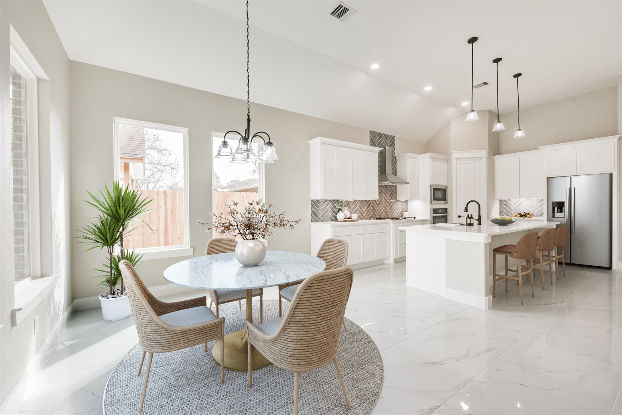 2803 Lancaster Lane Pasadena, TX 77506 - Photo 2 of 45 a dining room kitchen with stainless steel appliances kitchen island granite countertop a dining table chairs and white cabinets